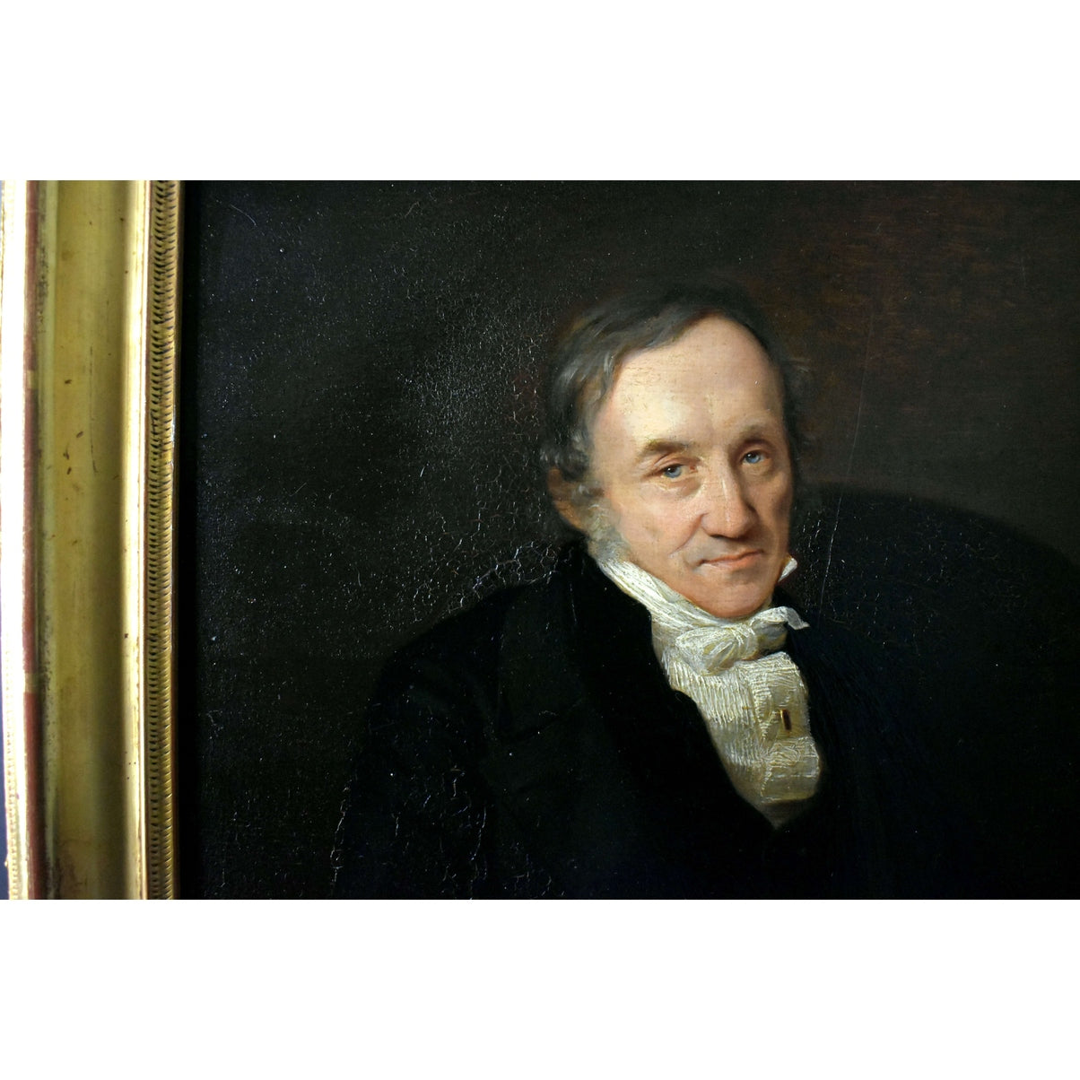 Close-up detail of 1848 gentleman portrait showing fabric textures and monogram signature