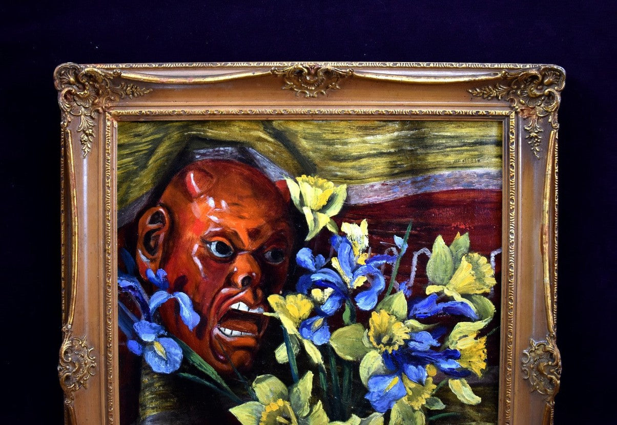 E. Gassée 1950s Belgian oil painting still life with red devil mask, blue irises, yellow daffodils in ornate gold baroque frame