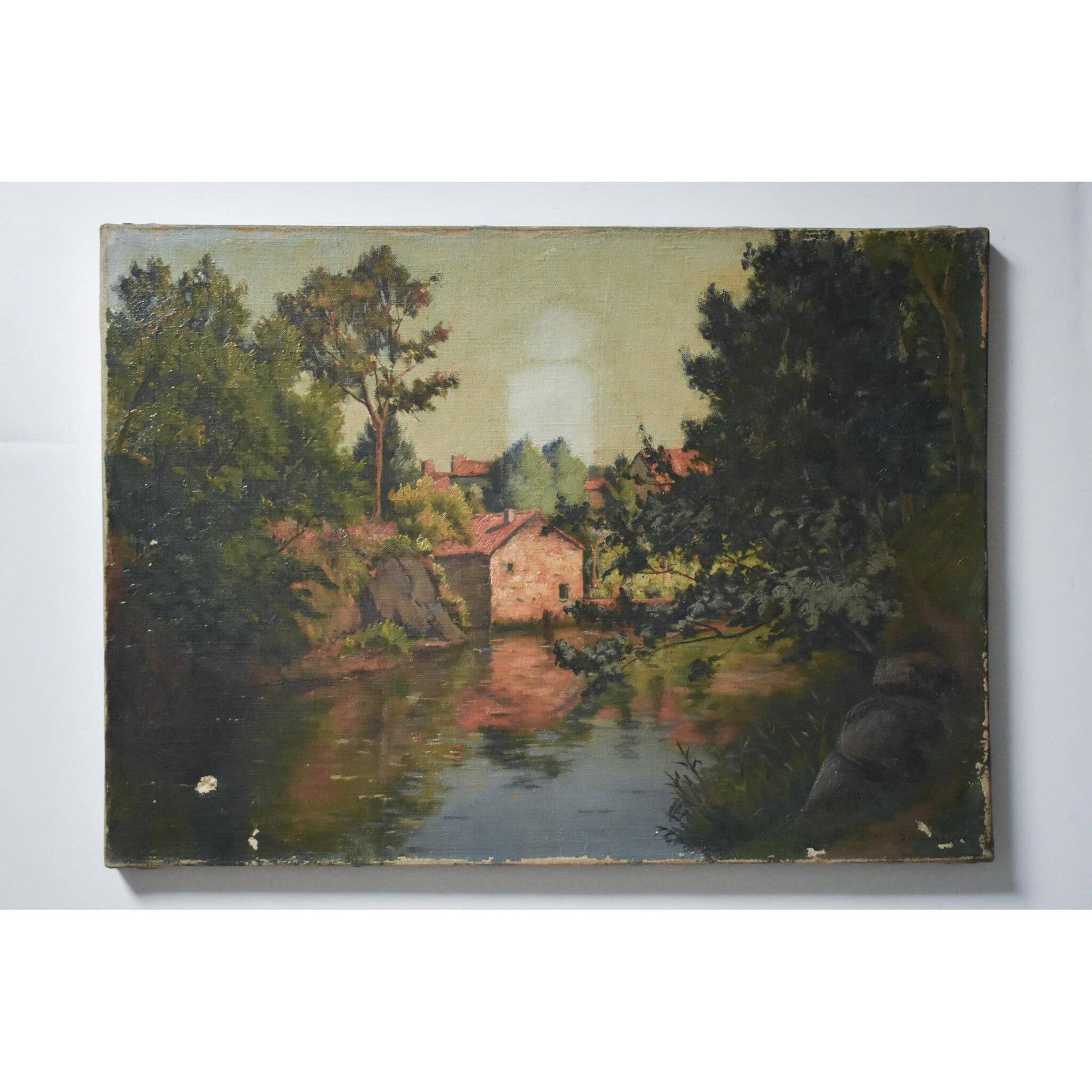 Antique landscape oil painting to be restored depicting a river bank village by Zenon Uzac for sale at Winckelmann Gallery