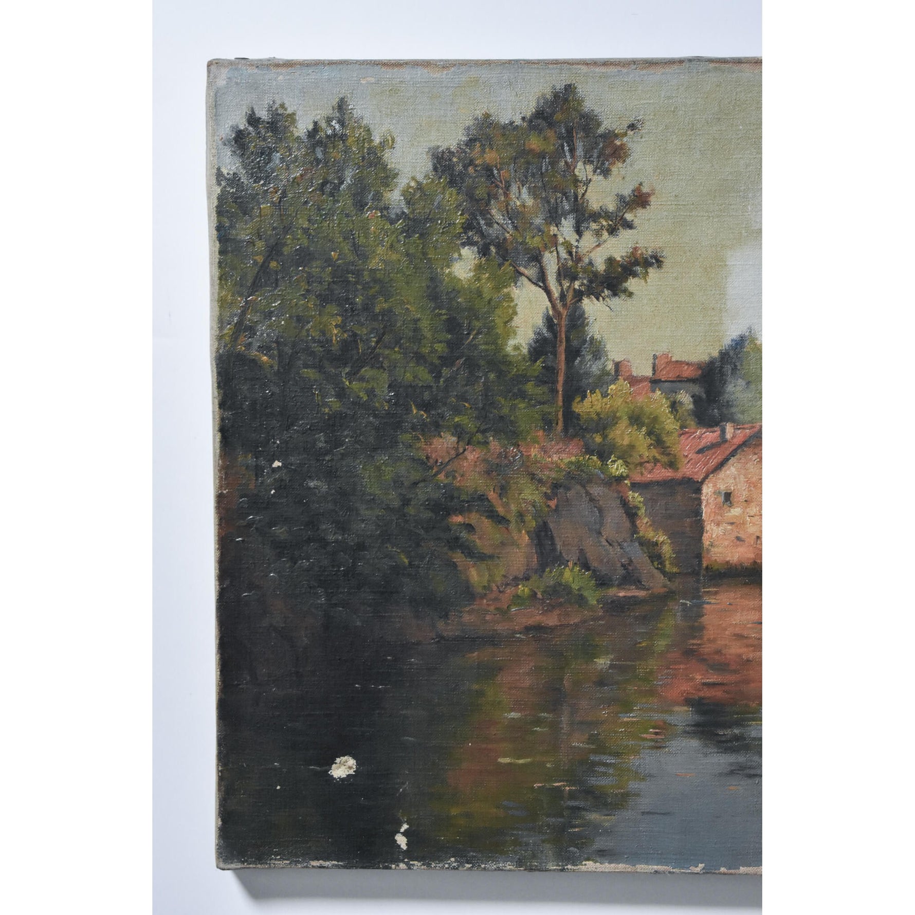 Antique landscape oil painting to be restored depicting a river bank village by Zenon Uzac for sale at Winckelmann Gallery