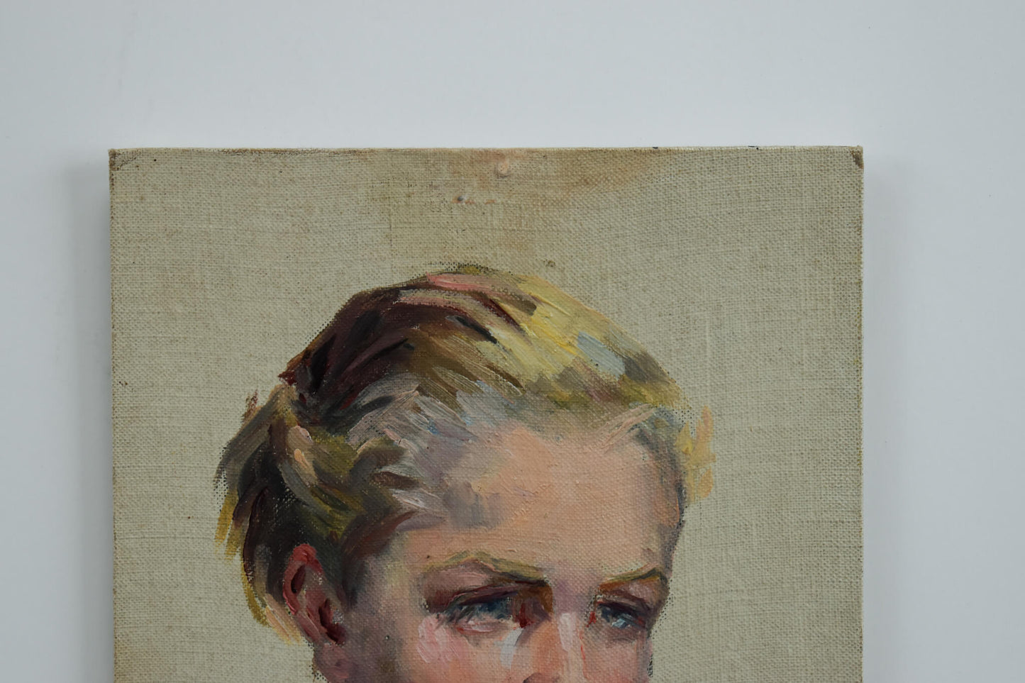 Vintage oil painting, portrait of a young woman with blue eyes circa 1940, by Odette Durand, for sale at Winckelmann Gallery